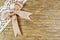 Beige ribbon on a wooden background