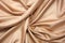 beige satin cloth bunched up into soft folds