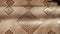 Beige silk fabric texture with diamond pattern