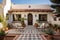 a beige spanish revival home with hand-painted tiles