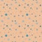 Beige speckled pattern with blue stars and circles