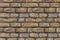 Beige stone chipped uneven weathered hard background base of many rectangular blocks