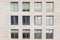 Beige stone wall with many windows