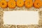 Beige straw hay background with pumpkins