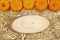 Beige straw hay background with pumpkins with wood sign