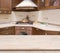 Beige table on defocused brown kitchen interior background