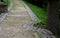 beige threshing path gravel with delimited edges granite cubes in a row and dividing channels from the cube trough channel due to