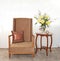 Beige upholstered chair with side table