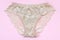 Beige women underwear with lace on pink background with copy space. Beauty fashion blogger concept. Romantic lingerie for