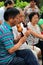 BEIJING, CHINA - JUL 17, 2011: Women and men are playing on traditional flutes in Jingshan park