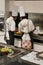 Beijing China - June 10, 2018: Two chefs serving a plate of cookies.