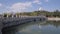 BEIJING, CHINA - MARCH 15, 2019: Beihai Park at Clear Summer Day. White Pagoda, Bridge and People. Wide Shot.