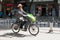 BEIJING, CHINA - MAY 12, 2013: Old man on electric motorbike