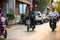 Beijing inhabitants on motorbikes at one of small Beijing streets hutong