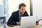 Being the best means defeating your competitors. a handsome young businessman sitting behind his laptop in his office.