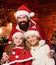 Being best Santa for them. Father Santa claus costume with family celebrating christmas. Lovely daughter with parents