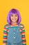 Being fancy child. Small child wear violet hair wig yellow background. Happy child with straight short hairstyle in