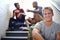 Being an individual in a diverse world. Portrait of a male university student sitting with his friends on the steps of a