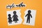 Being single mother after divorce concept. Paper cutouts demonstrating broken family on orange background, flat lay