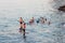 BEIRUT, LEBANON - AUGUST 14, 2014: Unknown people swimming in the blue water of the Mediterranean sea in the Raouche district in