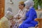 Bekasi, Indonesia - August 10th 2018: A Javanese bride-to-be asks for permission and forgiveness from her parents to carry out a t