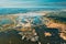 Belarus. Aerial View Of Road Through Ponds In Autumn Landscape. Ponds Of Fisheries In The South Of Belarus. Top View Of