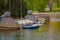 BELARUS, MINSK - MAY 01, 2018: Unidentified people close to a boats ready to rent and take a trip in the river Svisloch