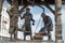 Belarus. Minsk. Monument City scales. Three townspeople who weigh the goods. May 21, 2017