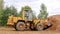 Belarus, Minsk - October 8, 2021: Tractor bulldozer drives close-up. Front-end loader using bucket. Road construction. Large