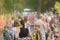 BELARUS,Mogilev - July 2,2022:A group of happy people at the Holly Colors carnival.People throw Holi colors into the air