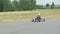 Belarus, Mogilev region, Bobruisk - June 25, 2022: A boy in helmet rides on kart on an asphalt site