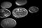 Belarusian coins scattered on a dark surface close-up. Monochrome money background