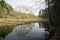 Belarusian landscape. A solid spring day in April. Forest river Vyacha. Reflection in water.