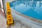 Belek, Turkey - October 2020: Safety measures at a luxury hotel. Warning sign about wet floor near a swimming pool. Being careful