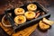 Belem cakes or Pasteis de Belem, Portuguese pastel de Nata Custard Tarts. Dark background. Top view