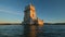 Belem Tower on the bank of the Tagus River on sunset. Lisbon, Portugal