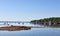 Belfast Maine harbor at low tide on a summer day with distant sailboats