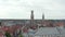 Belfry of Bruges Belltower from an Aerial Drone perspective and Pigeon Birds flying with Cloudy Sky