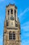 Belfry of Bruges, the medieval bell tower against blue sky. The 83 meter high belfry or hallstower halletoren is Bruges` most