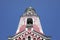 Belfry of Candlemas church in Professionalnaya street with blue sky in background. Sunny daylight view.