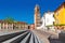 Belfry and colorful houses in La Morra, Italy.