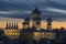 Belfry and domes of the Assumption Cathedral of the Tikhvinsky Monastery on a cloudy evening. Russia