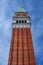 Belfry of St. Mark`s Basilica in Venice, Italy.Campanile di San Marco in Italian. Photographed from below along the wall