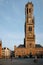 Belfry tower and Grote markt square in Bruges, Belgium on sunset