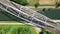 Belgian bridgescape: aerial view of train over river amidst forest