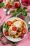 Belgian Liege waffles with strawberry ice cream and fresh berries