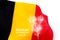 Belgian National Day concept of Belgium flag on white background with belgian national day and 21st july text and firework