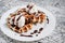 Belgian waffle with ice cream, chocolate on a wooden background