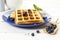 Belgian waffles, blueberries and vanilla ice cream