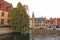 Belgium, Bruges, ancient houses and trees on the shore